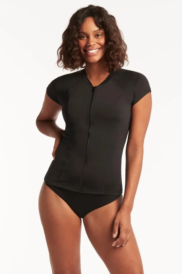 Eco Essentials Short Sleeve Rash Vest Eco Essentials Black Women Sea Level Surf Suits and Rash Vests Eco Essentials Short Sleeve Rash Vest Eco Essentials Black Women Sea Level Surf Suits and Rash Vests
